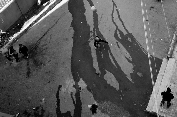 © Stephen Boyle - Syrian refugee children playing football in their UNHCR run settlement. Balbeek, Lebanon February 2014