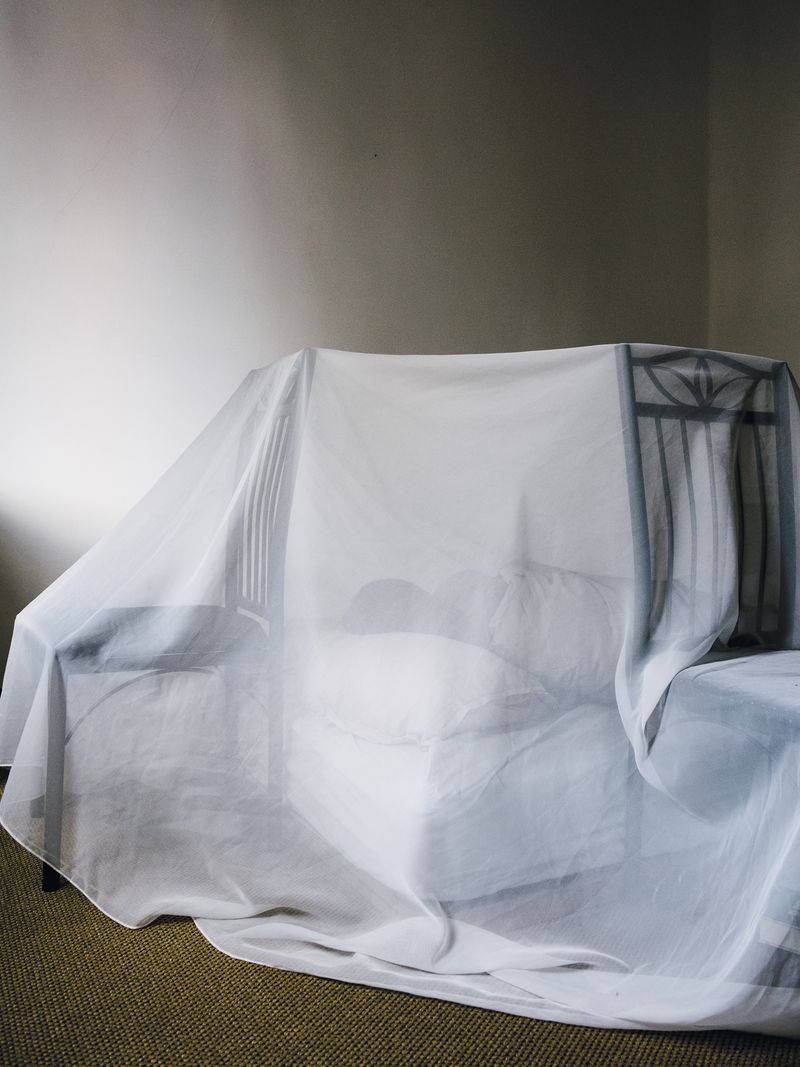 © Nick Somers - Sleeping underneath protective fabric.