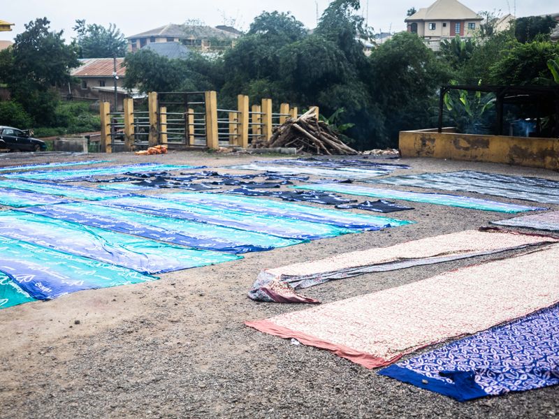 © Adegoke Kolawole - The YardFreshly dyed adire laid across the open drying yard, Abeokuta, 2025.