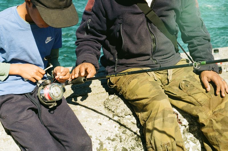 © Celeste Jacobs - A father helps his son connect the main line, 2026