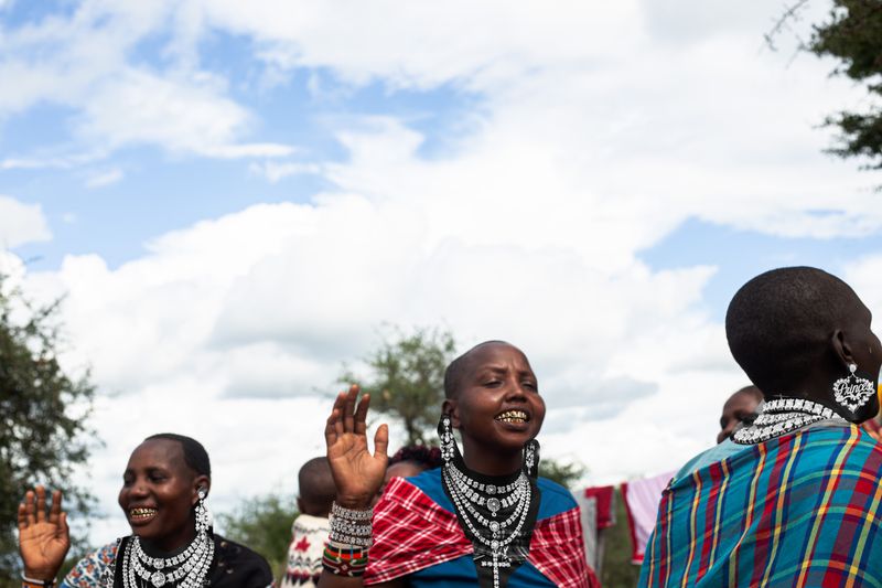 © Ashley sky Walker - Not every girl got invited to that world. These ones built their own. Photographed in a Maasai village, Kenya. AI composite.