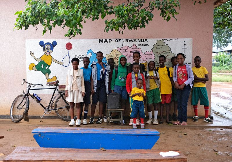 © Zahra Farajasri - School — Bugesera, Rwanda, 2026  - Schoolchildren photographed in front of a map of Rwanda in Bugesera.