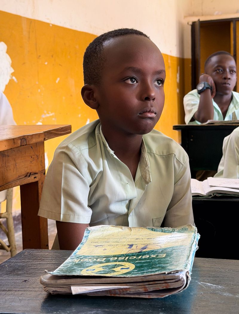 © Zahra Farajasri - School — Bugesera, Rwanda, 2026 - A student in his classroom in Bugesera.
