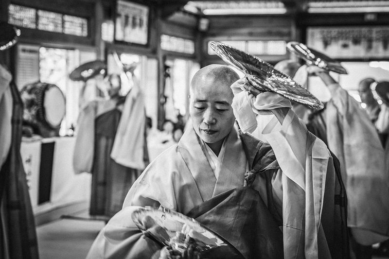 © Min A Choi - A Buddhist nun in the Bara dance, seen close. Jingwansa Temple, 2026.