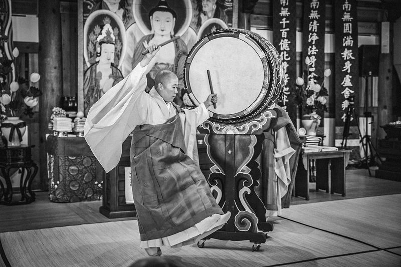 © Min A Choi - Striking the ceremonial drum, sleeves in motion. Jingwansa Temple, 2026.