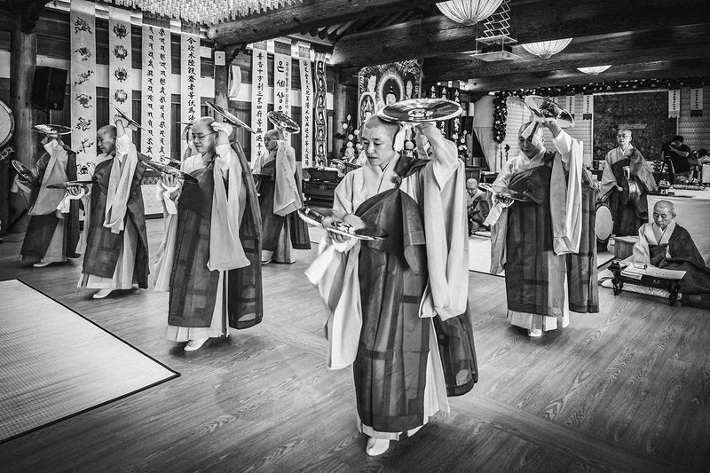 © Min A Choi - The Bara dance, cymbals raised in unison. Jingwansa Temple, 2026.