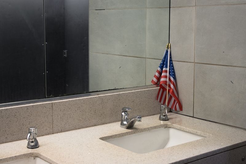 © lou muñoz - South Station Flag, 2025, Inkjet Print. Borderless two-page spread.