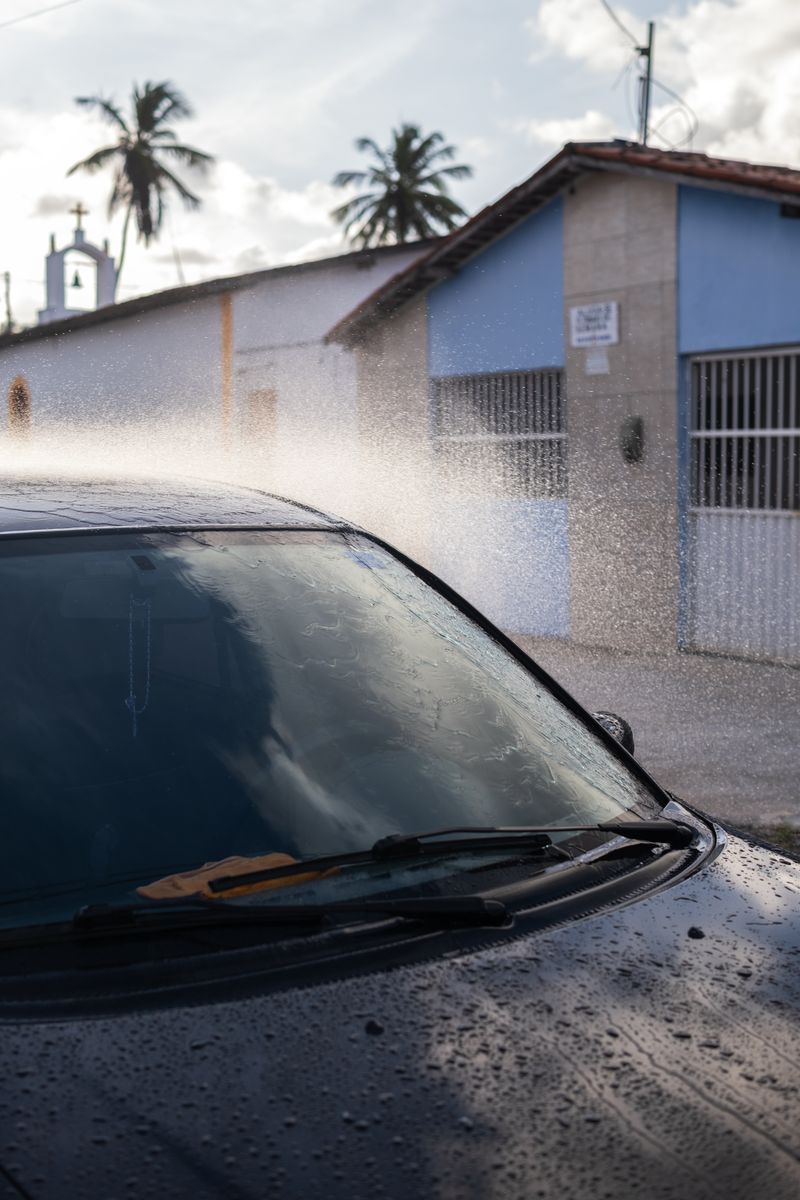 © Sabine van Wechem - Washing the car on Sunday afternoons is a weekly activity.