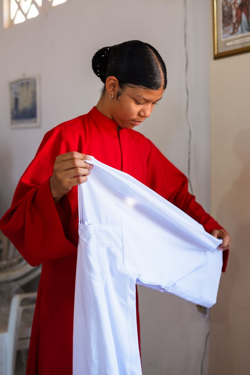 © Sabine van Wechem - A girl on Sunday, in church after the service on the Day of the Death.