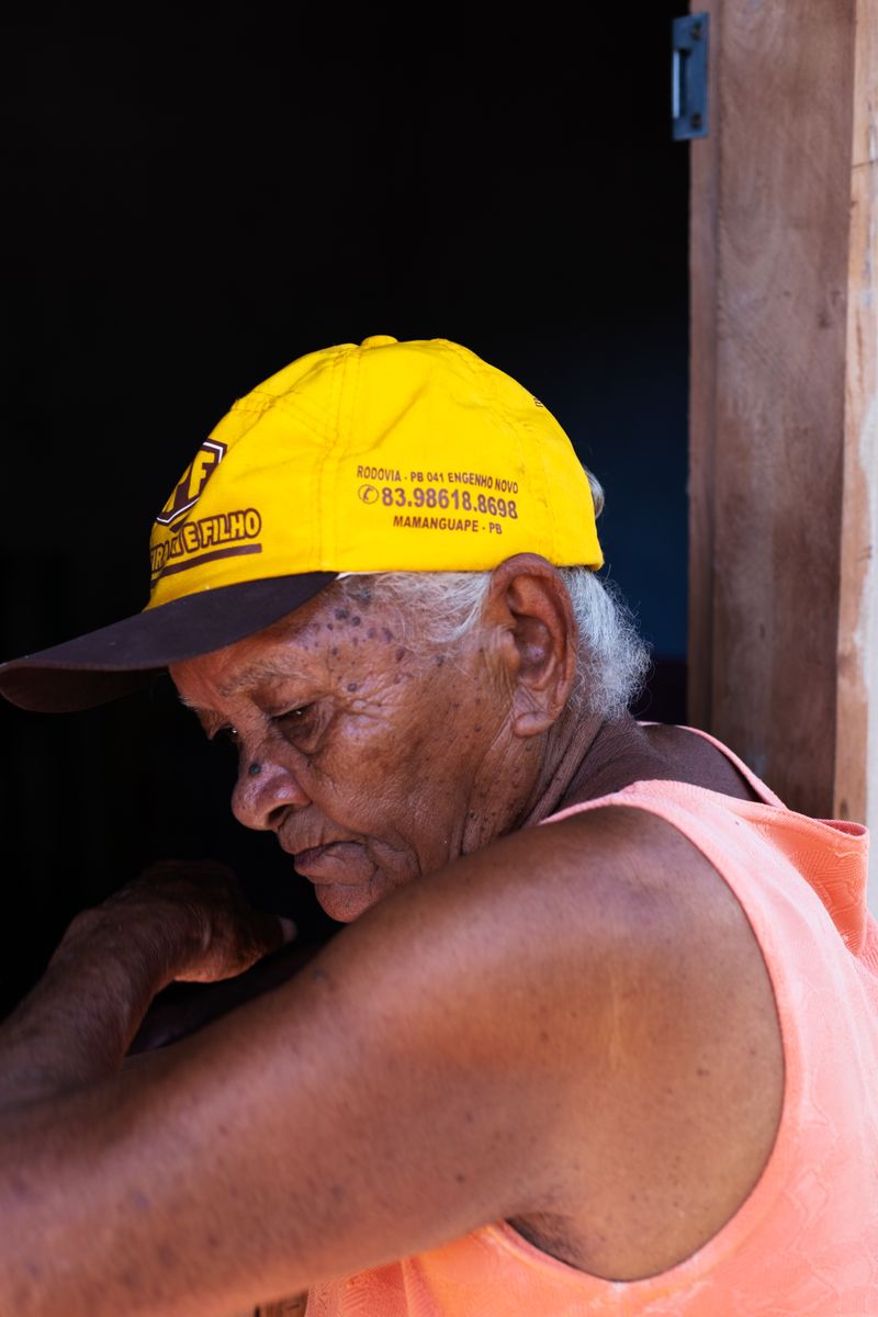 © Sabine van Wechem - The grandmother, Maria, in front of her house.