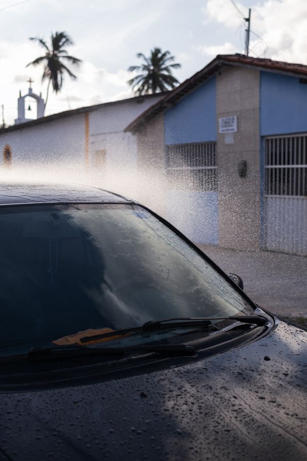 © Sabine van Wechem - Washing the car on Sunday afternoons is a weekly activity.