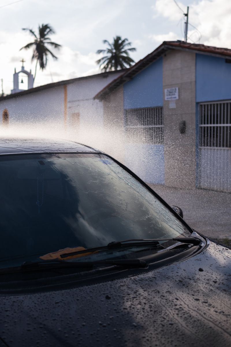 © Sabine van Wechem - Washing the car on Sunday afternoons is a weekly activity.