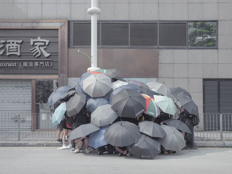 © Thaddé Comar - It's Raining (Name of this tactic used to hide radical actions. )
