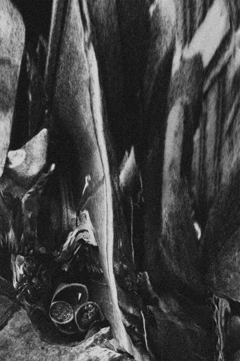 © Gene Chen - Flower pots casually stacked at the entrance of a residence, looking neglected.