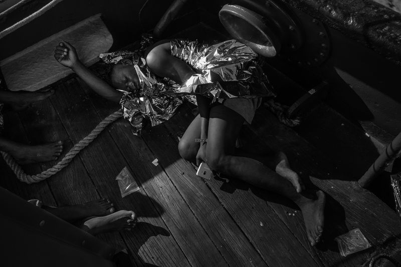© Francesco Bellina - A man, immediately after the rescue, rests on the ship “Mare Jonio”.