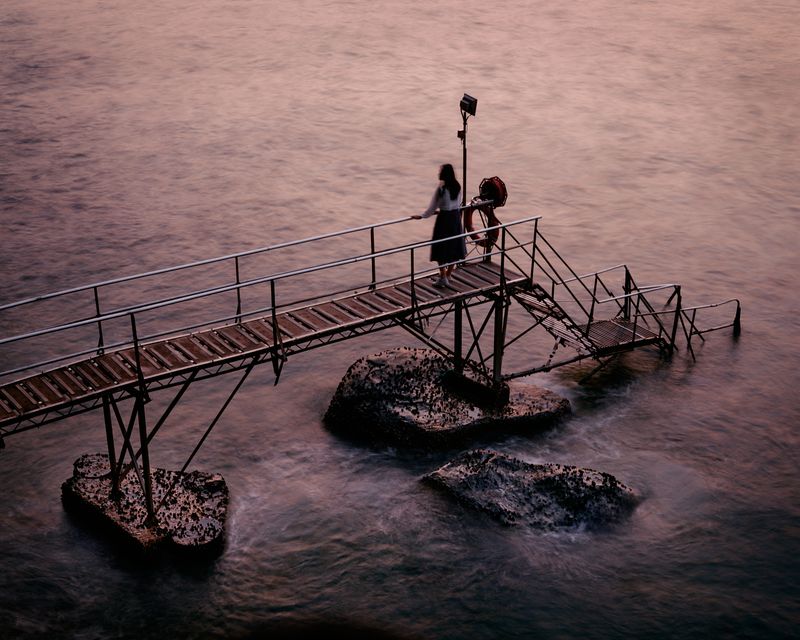 © Chung-wai Wong - A teenage girl looking west, Sai Wan Swimming Shed, the western end of Hong Kong Island.