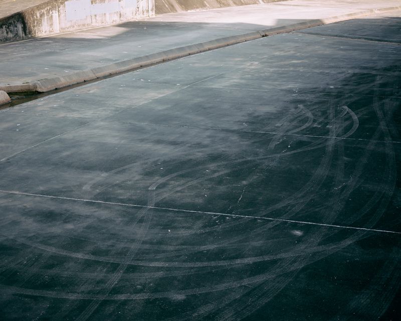 © Chung-wai Wong - Tyre tracks on Shing Mun River.