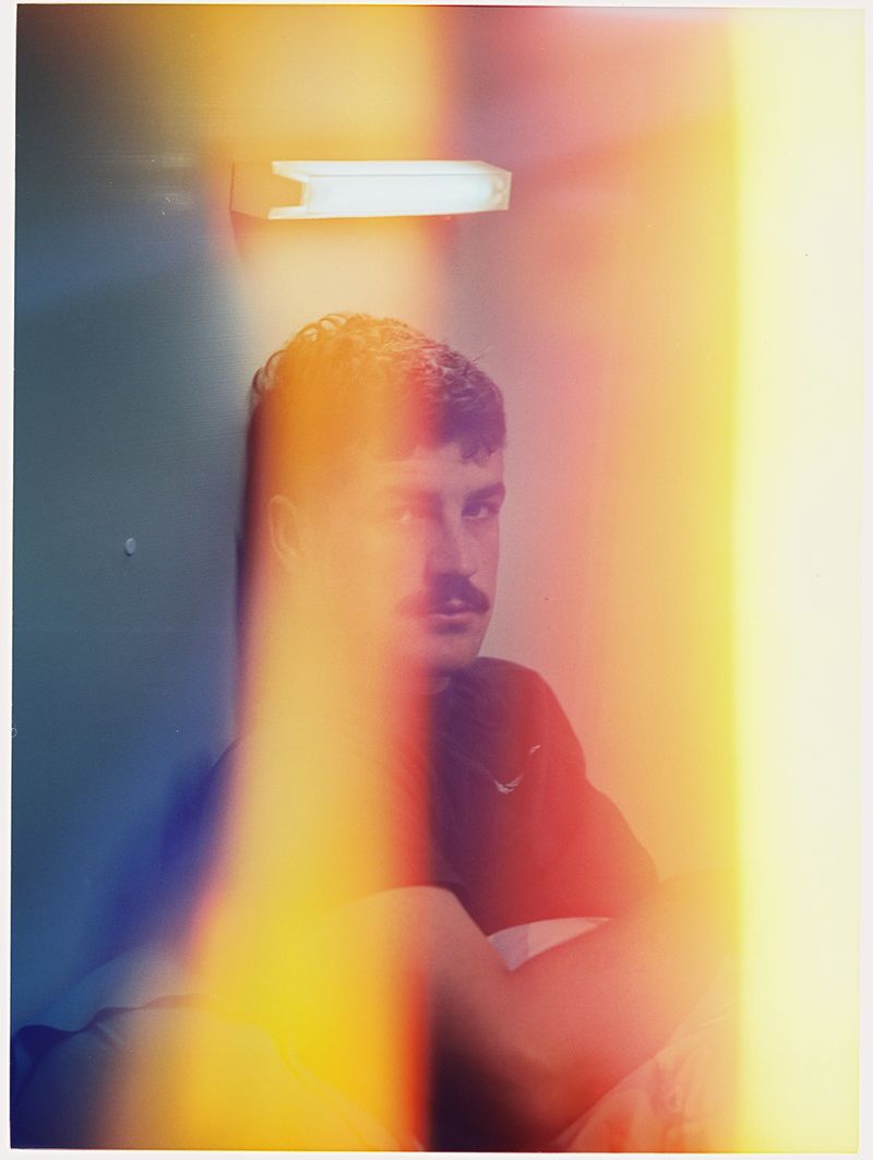 © Emmaline Zanelli - A young Fly-In, Fly-out worker wakes up in his dorm for his night shift at the mine site. 2023