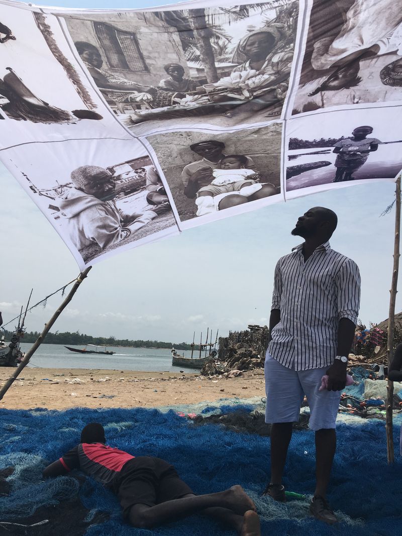 © Ofoe Amegavie - Curatorial concept, Viewing photos printed on a sample Abala. 2019