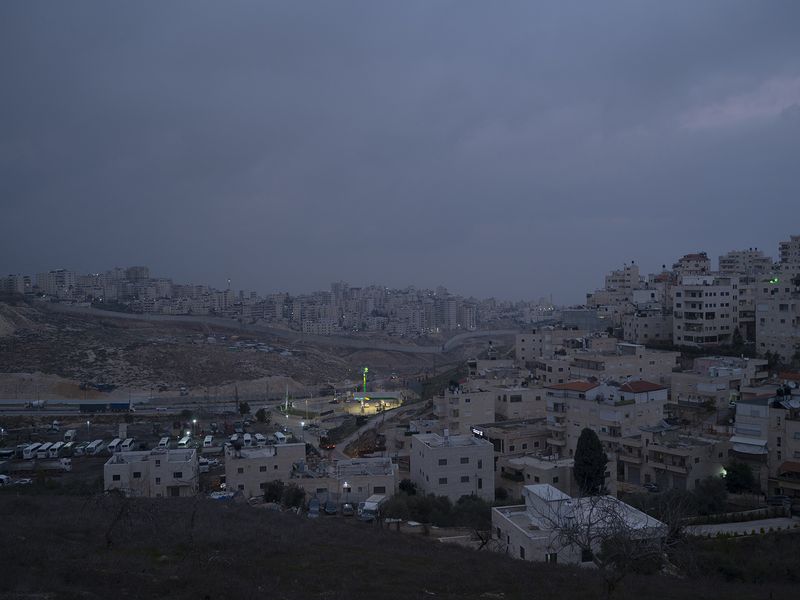 © Edith Geuppert - the East Jerusalem neighborhood Al-Issawiya and behind the Seperationwall the Refugeecamp Shuafat