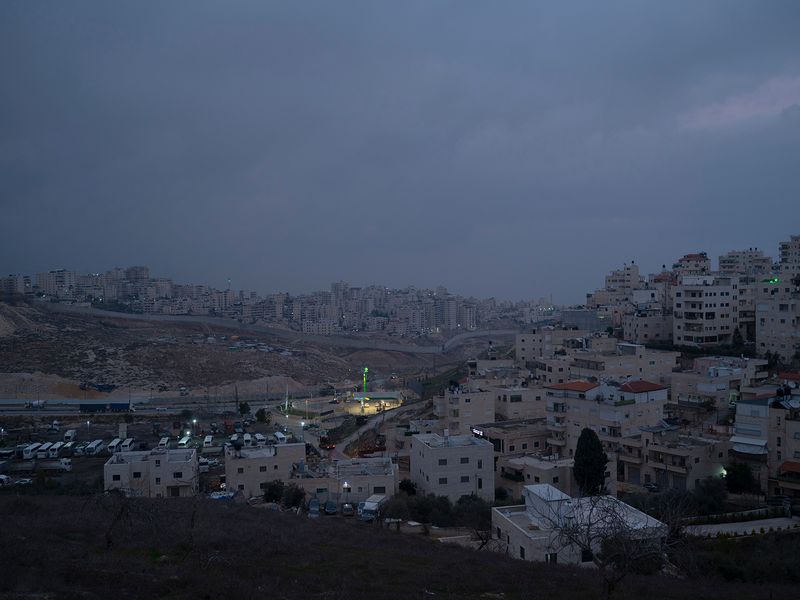 © Edith Geuppert - the East Jerusalem neighborhood Al-Issawiya and behind the Seperationwall the Refugeecamp Shuafat