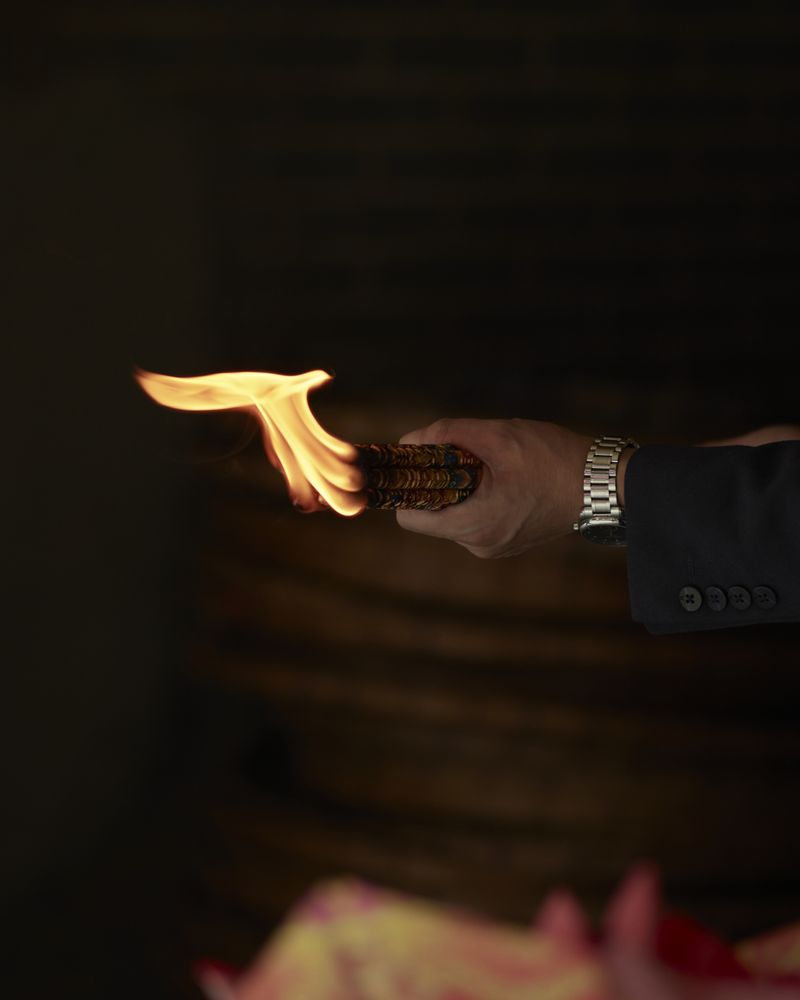 © YANG YANG - A person who burns incense.