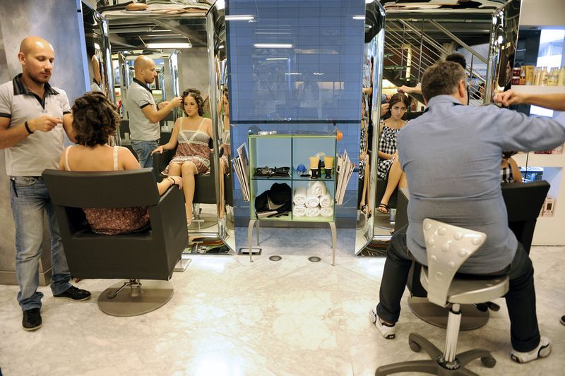 © Natalie Naccache - Nour, 18, and Carine, 18, have their hair groomed at a hair salon in Beirut in preparation for their high school prom.