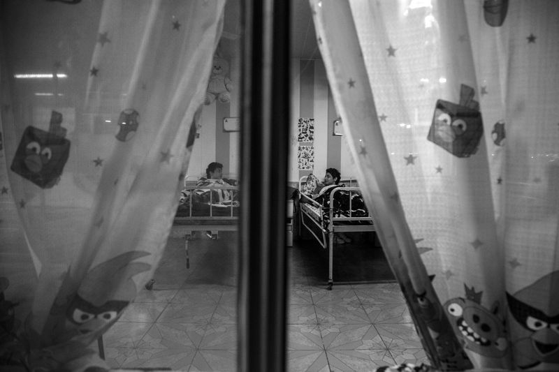 © Azadeh Besharati - Shima and Shiva at the Rasht Nursing House, the place where they were living there more than a decade.