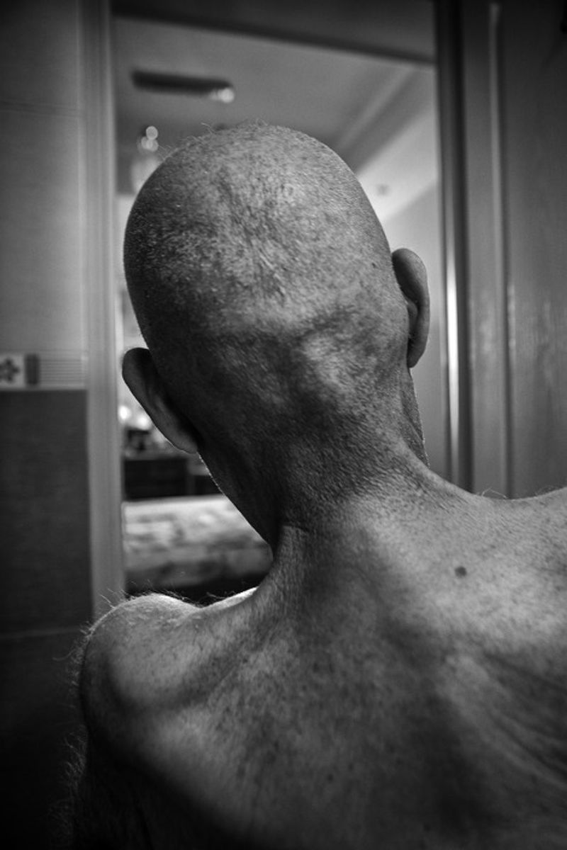 © Jalal Shams Azaran - Father is in the bath. He was unclothed. He is waiting for his daughter to wash him.