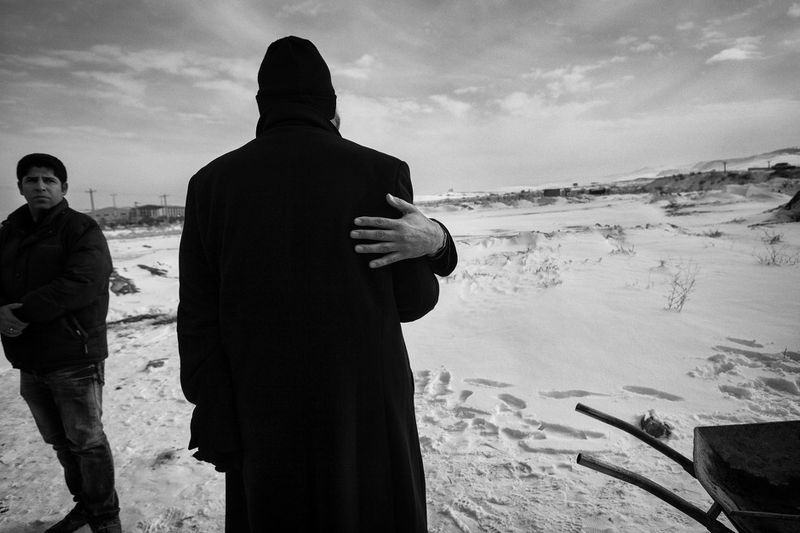 © Jalal Shams Azaran - They are father’s relatives condolence each other.