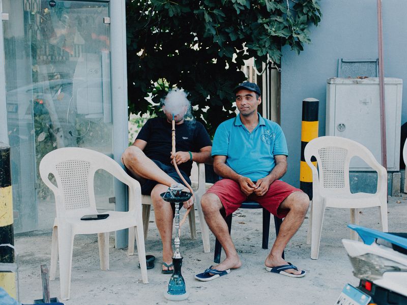 © Habib Saleh - Two men smoking shisha on the side road in the town of Joun, Lebanon
