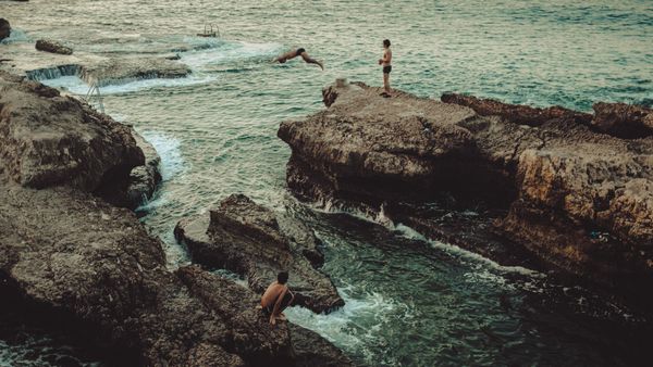© Habib Saleh - Three boys enjoying a swim at one of the last remaining public beaches in Beirut, Lebanon 2023.