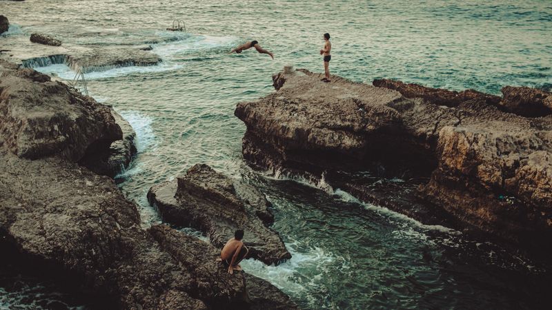 © Habib Saleh - Three boys enjoying a swim at one of the last remaining public beaches in Beirut, Lebanon 2023.