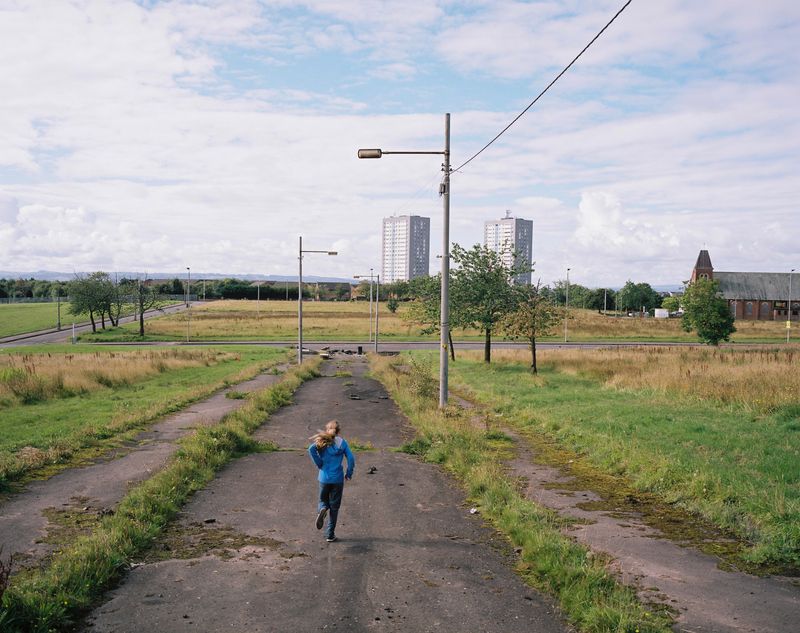 © Kirsty Mackay - Ruby runs down Pilton Road, Drumchapel.