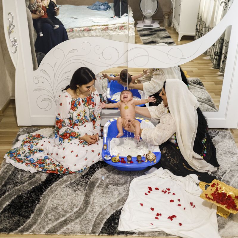 © Johanna Maria Fritz - Larissa’s son during the witches’ baptism in Mihaela’s house. Mogoșoaia, Romania, 2019.