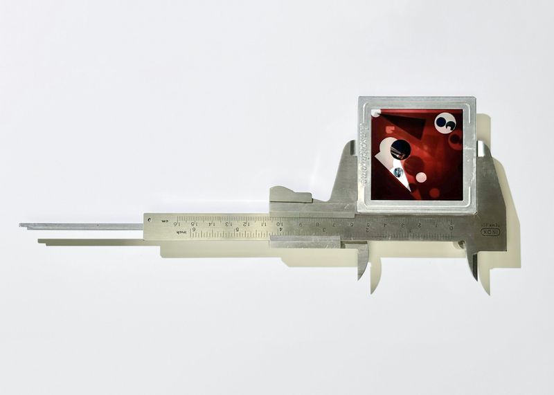 © Charalambos Artemis - Vernier caliper, fragmented photographic sailing archive in 6x6cm Anscochrome metal slide mount.