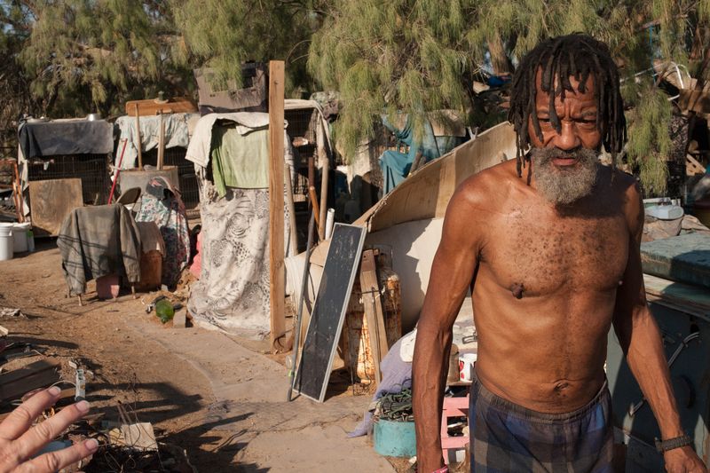 © Jason Houge - Papa Cat, originally from Milwaukee, Wisconsin, runs the only cat sanctuary in the Slabs; Slab City, USA 2018