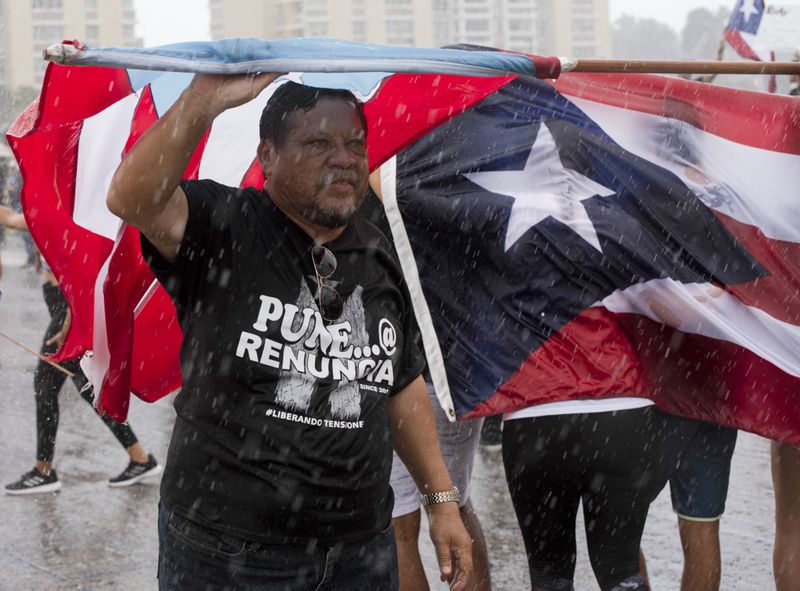 © Sally Rodriguez - man under the flag