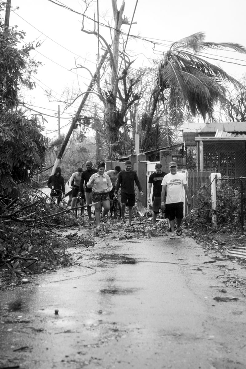 © Sally Rodriguez - neighbors going to helps others