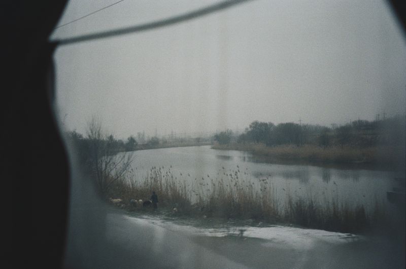 © lucile brizard - A view from the train heading eastward towards Ukraine’s frontline. East of Ukraine, 2023