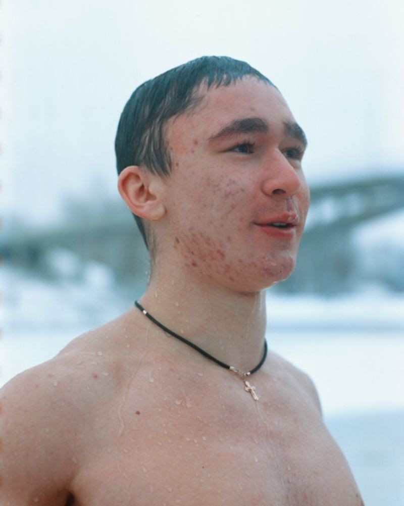 © lucile brizard - A young man emerges from the icy waters after his annual Epiphany plunge. Kyiv, Ukraine, January 6, 2026