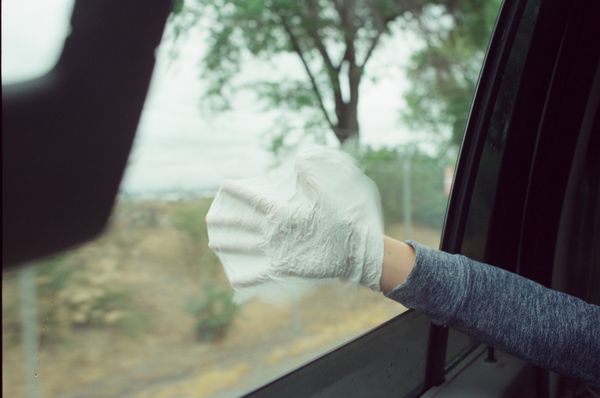 © lucile brizard - A young boy sticks his hand out of the window while riding in a car. Kramatorsk, Donetsk region, Ukraine, 2023