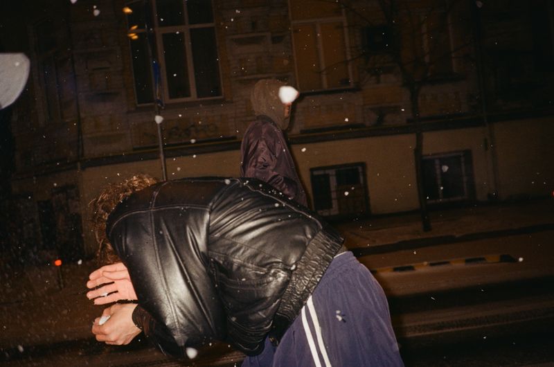 © lucile brizard - Andriy shelters from a snowball. Kyiv, Ukraine, 2022.