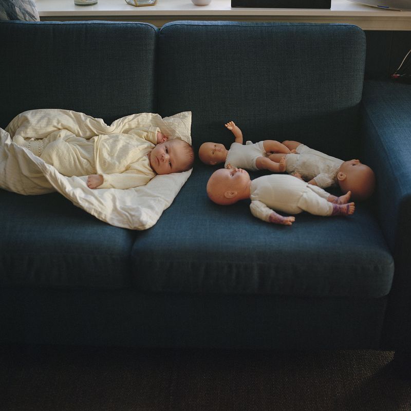 © Mirjam Stenevik - Luca is laying beside some freshly tattooed dolls, courtesy of his big sister Olivia.