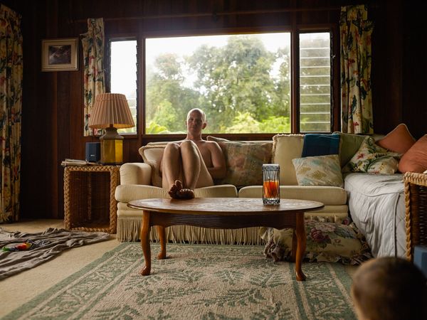 © Eri Morita - The owner was mowing the yard naked at the nudist guesthouse in Maui.