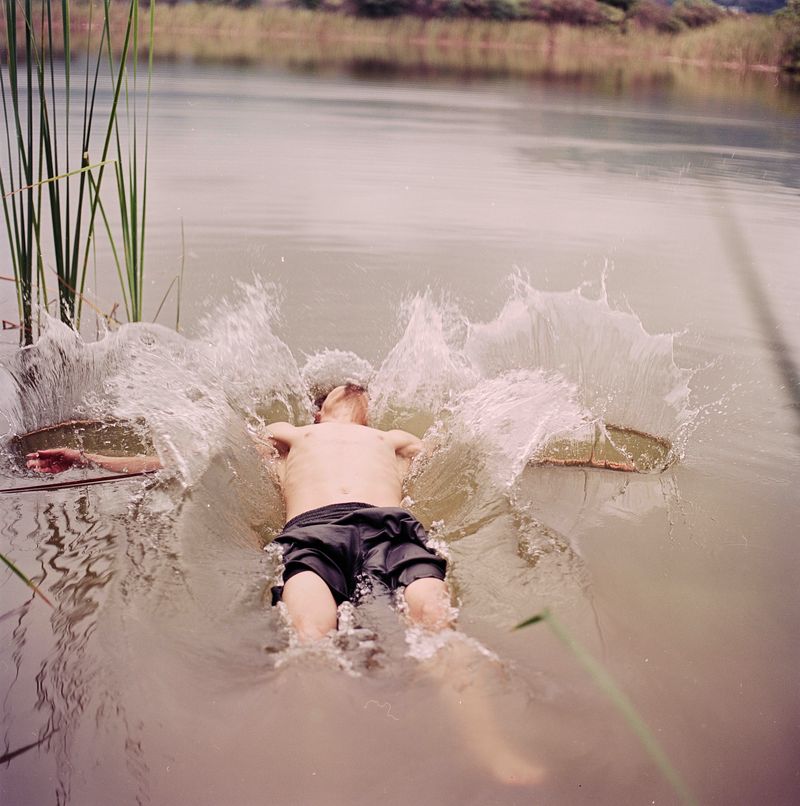 © María García - José, my husband, teaching my son to swim in a lake.