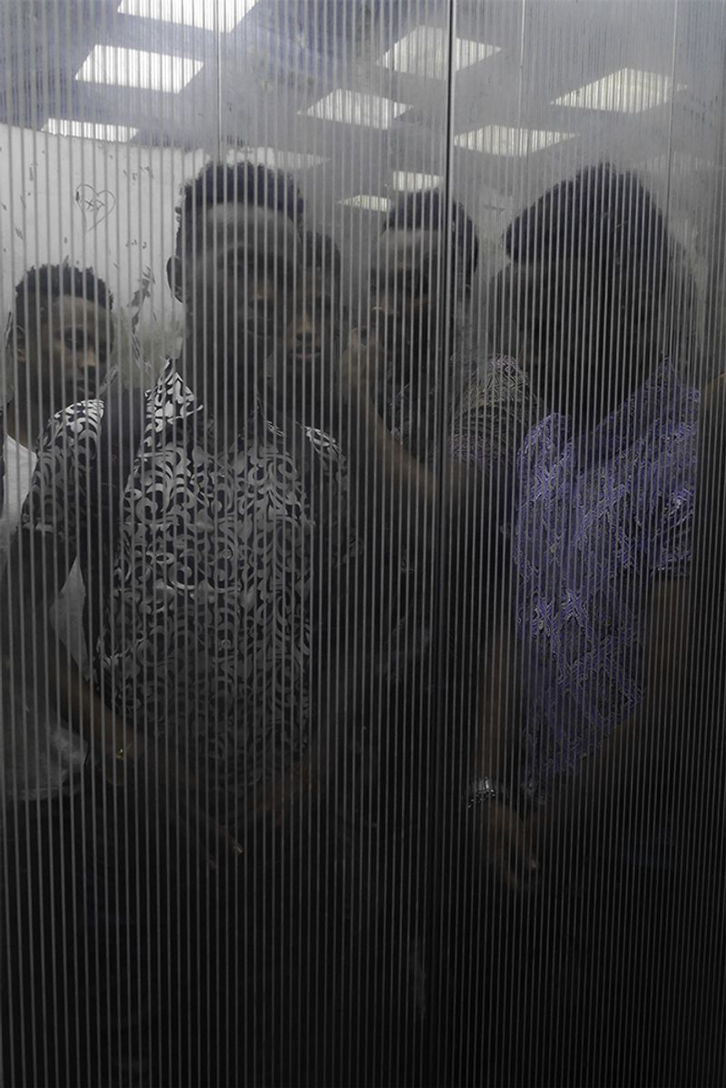 © Min Ma Naing - Somalian youths are seen at the elevator of their apartment, Dhaka, Bangladesh, on 13th April 2018.