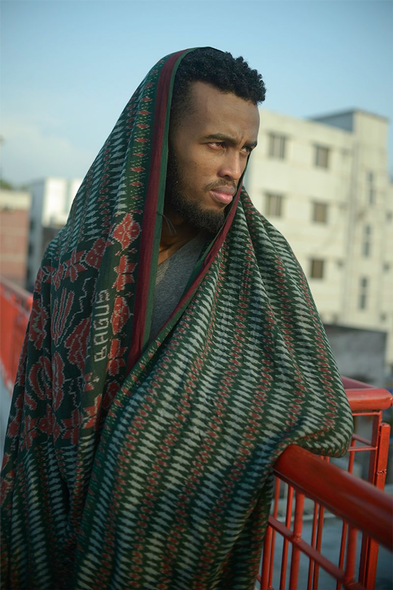 © Min Ma Naing - Abdullah posts for the portrait at the rooftop of his apartment in Dhaka, Bangladesh, on 19th April, 2018.