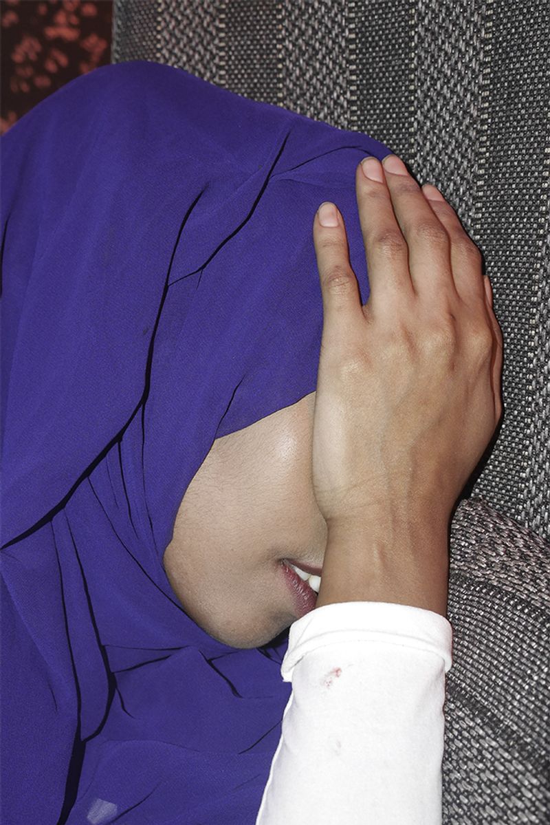 © Min Ma Naing - Hanni cries on the farewell party of her Somalian fried in Dhaka, Bangladesh on 9th of April 2018.