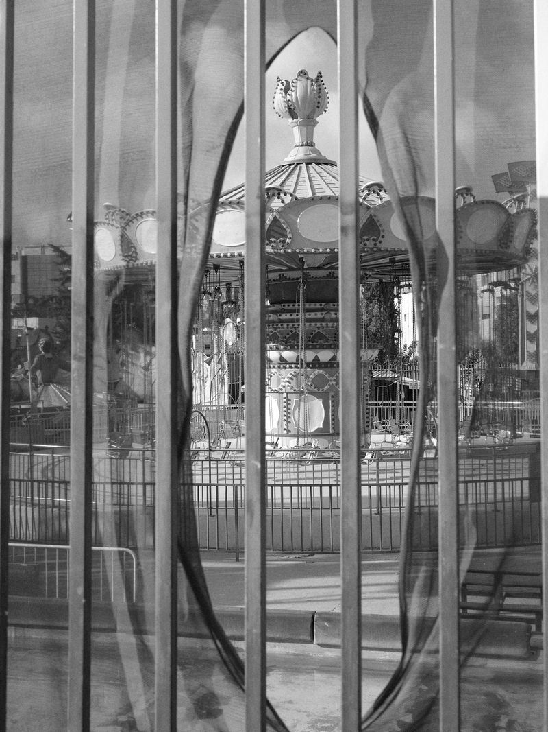 © Hamzeh Zahran - Looking Through the Fence of an Amusement Park, Amman, 2025, from the "Remains" series